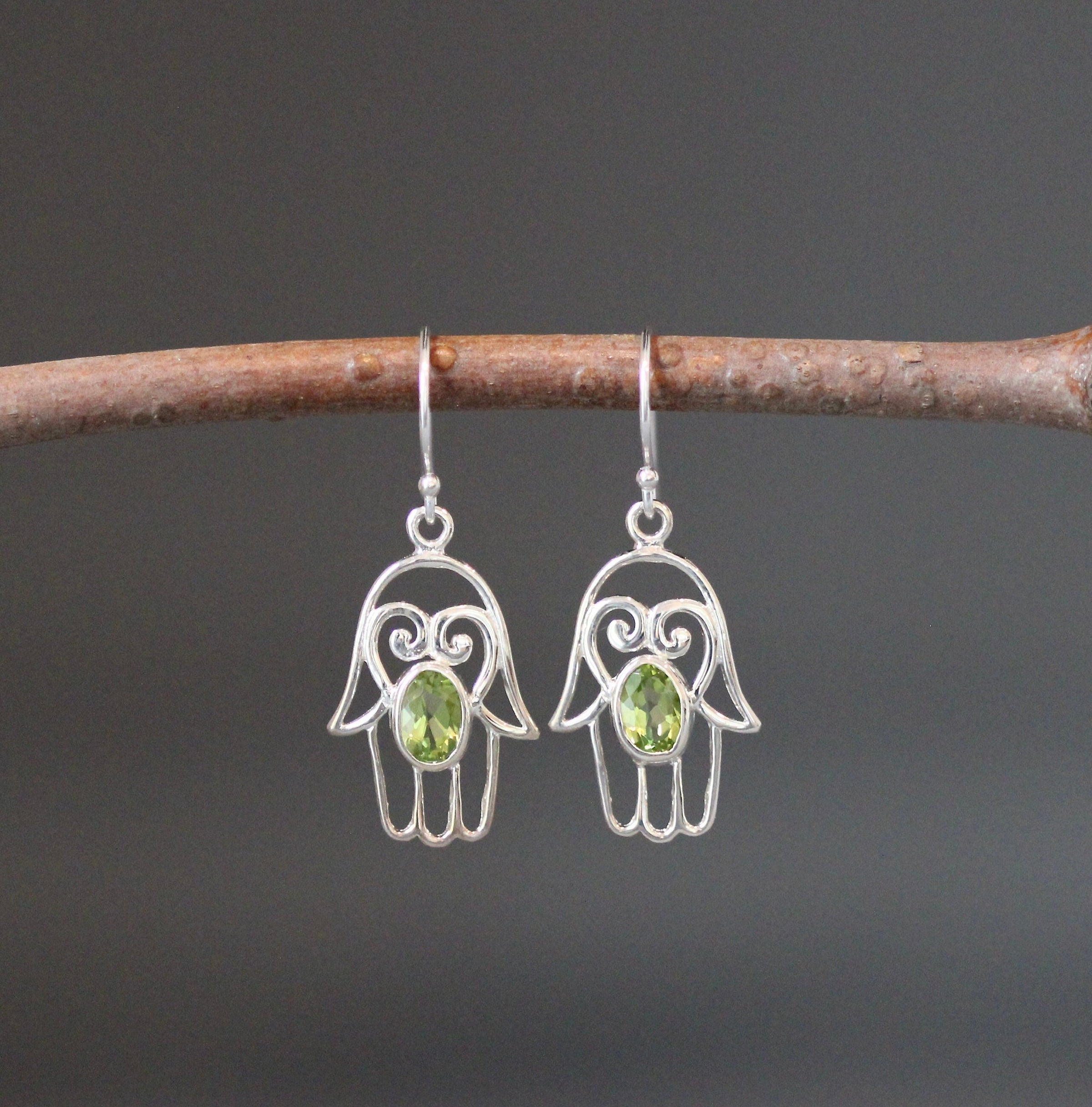 Sterling silver hamsa dangle earrings with green oval peridot gemstone charms