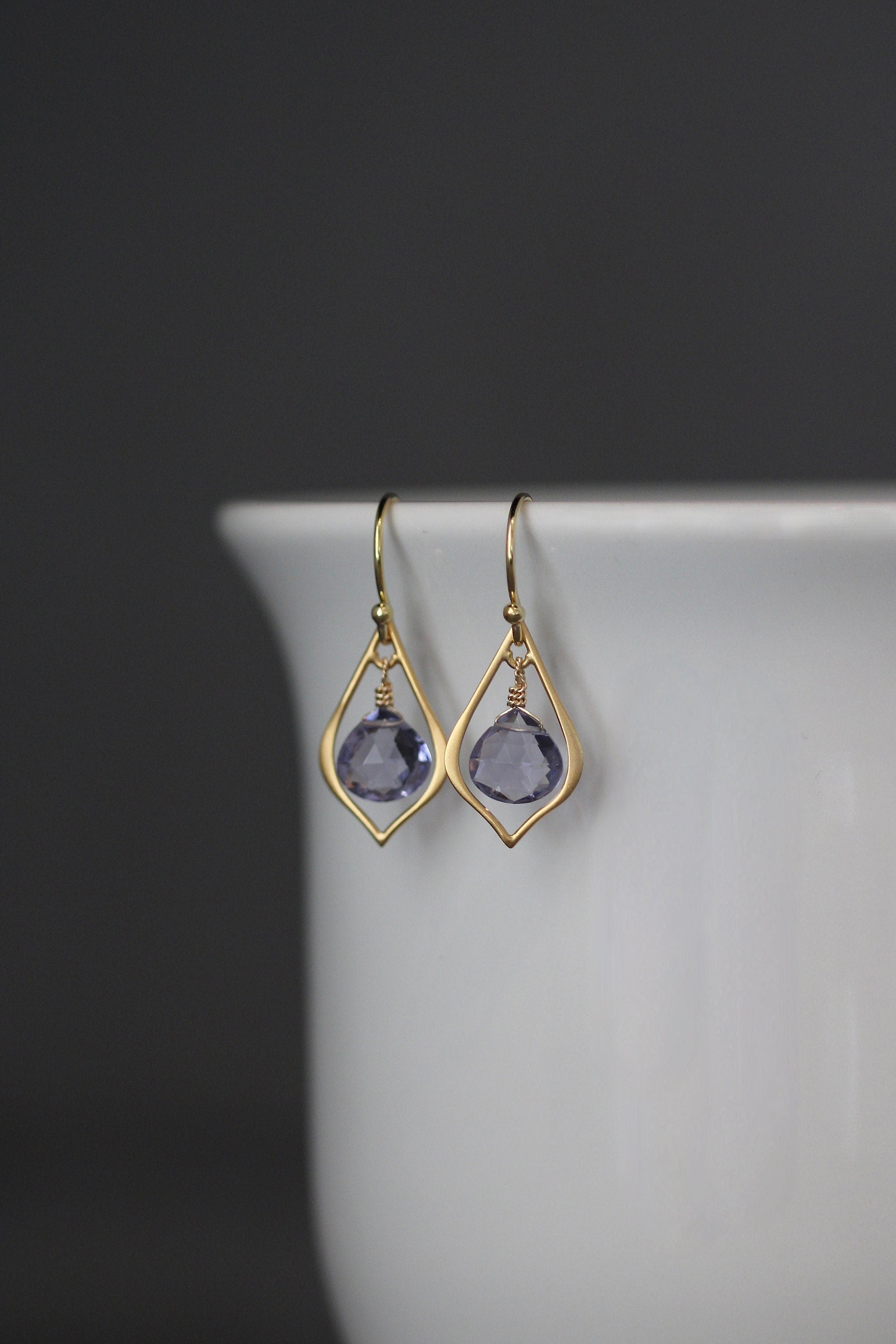 Matte gold vermeil chandelier earrings with dark purple teardrop gemstones