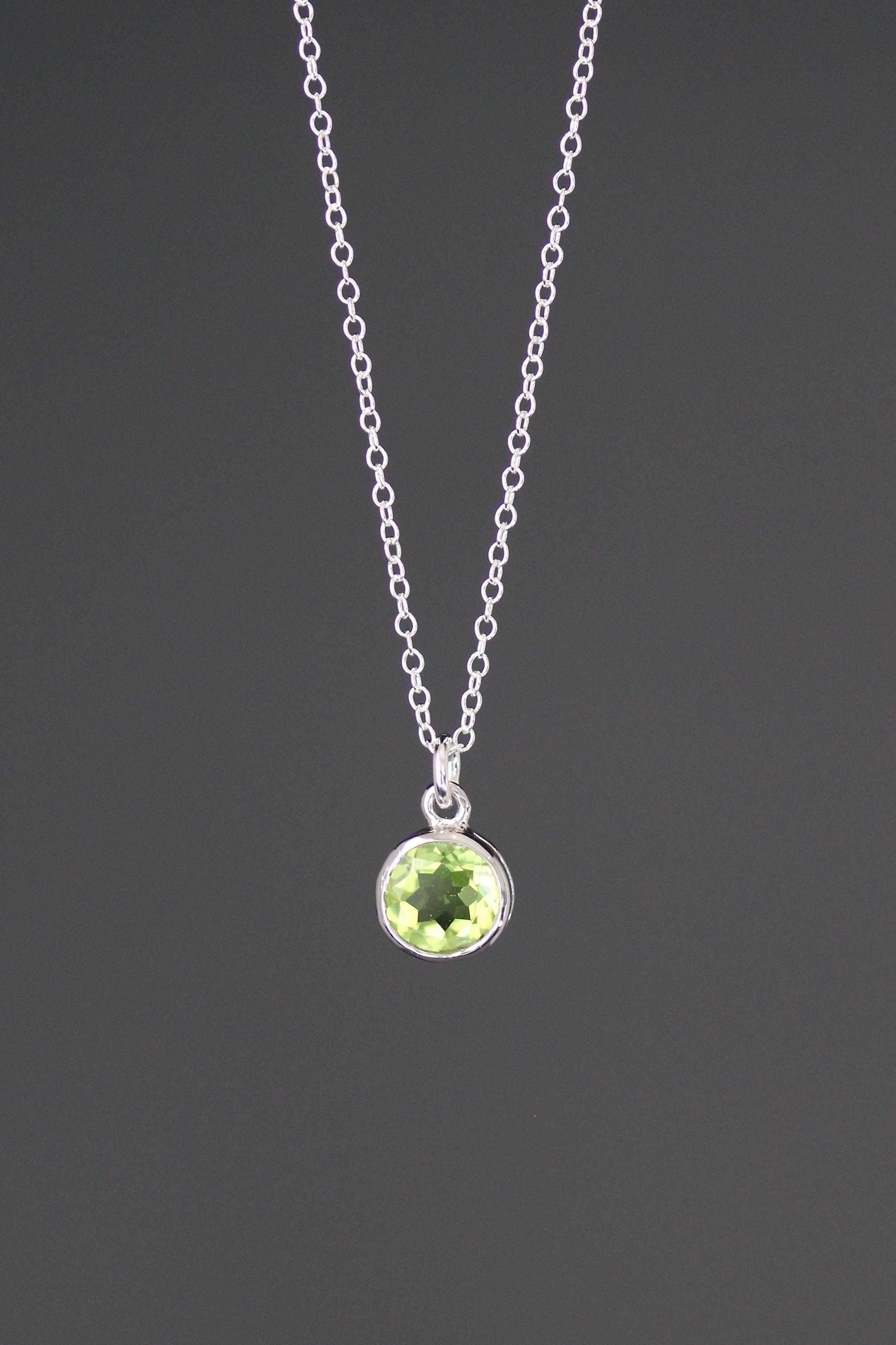 Sterling silver peridot pendant necklace with round green bezel-stone on chain