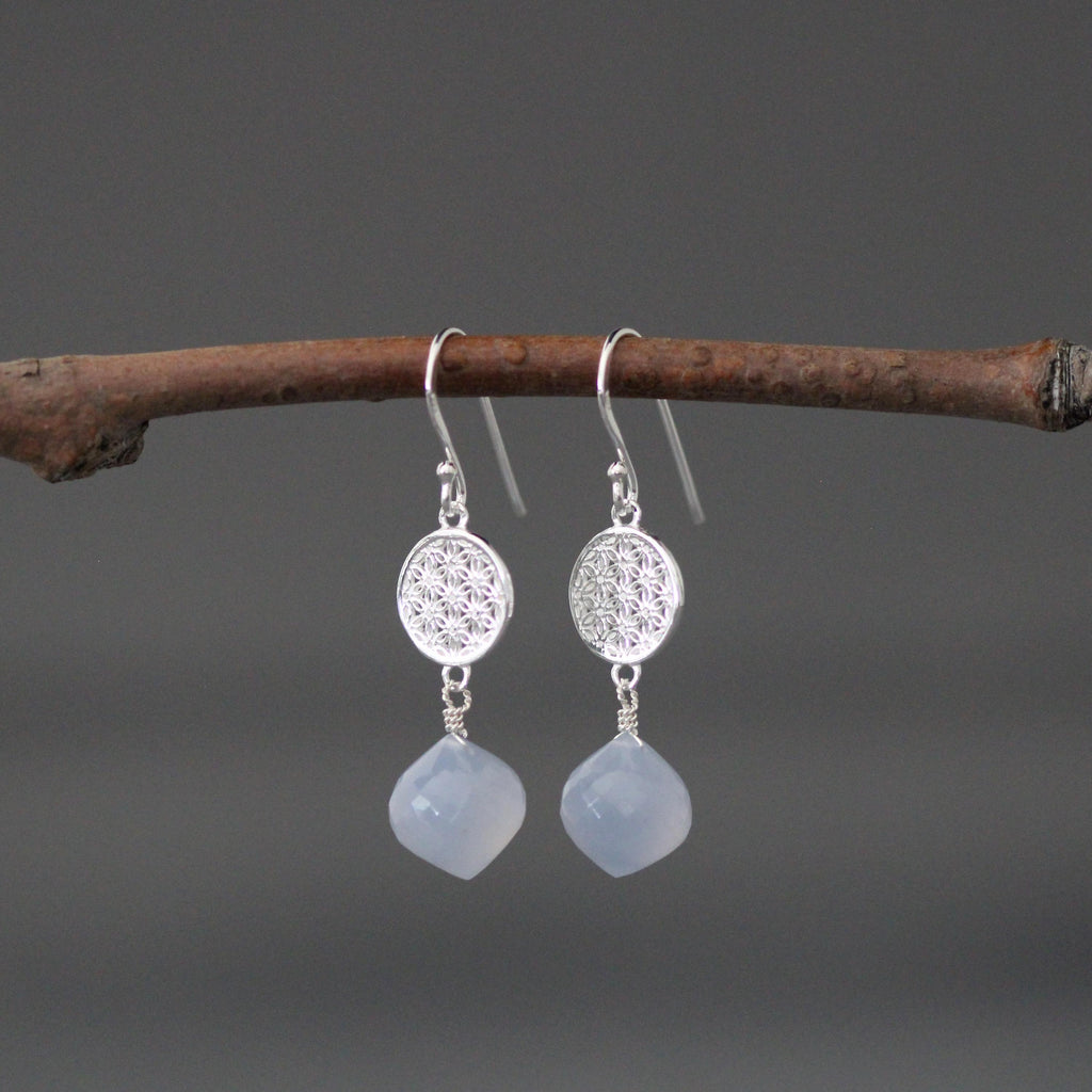 Sterling silver dangle earrings with round filigree disks and faceted blue teardrops