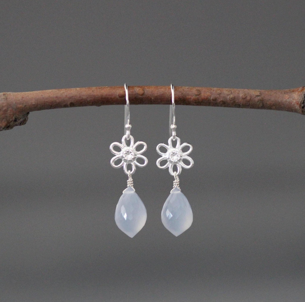 Sterling silver flower earrings with blue teardrop drops