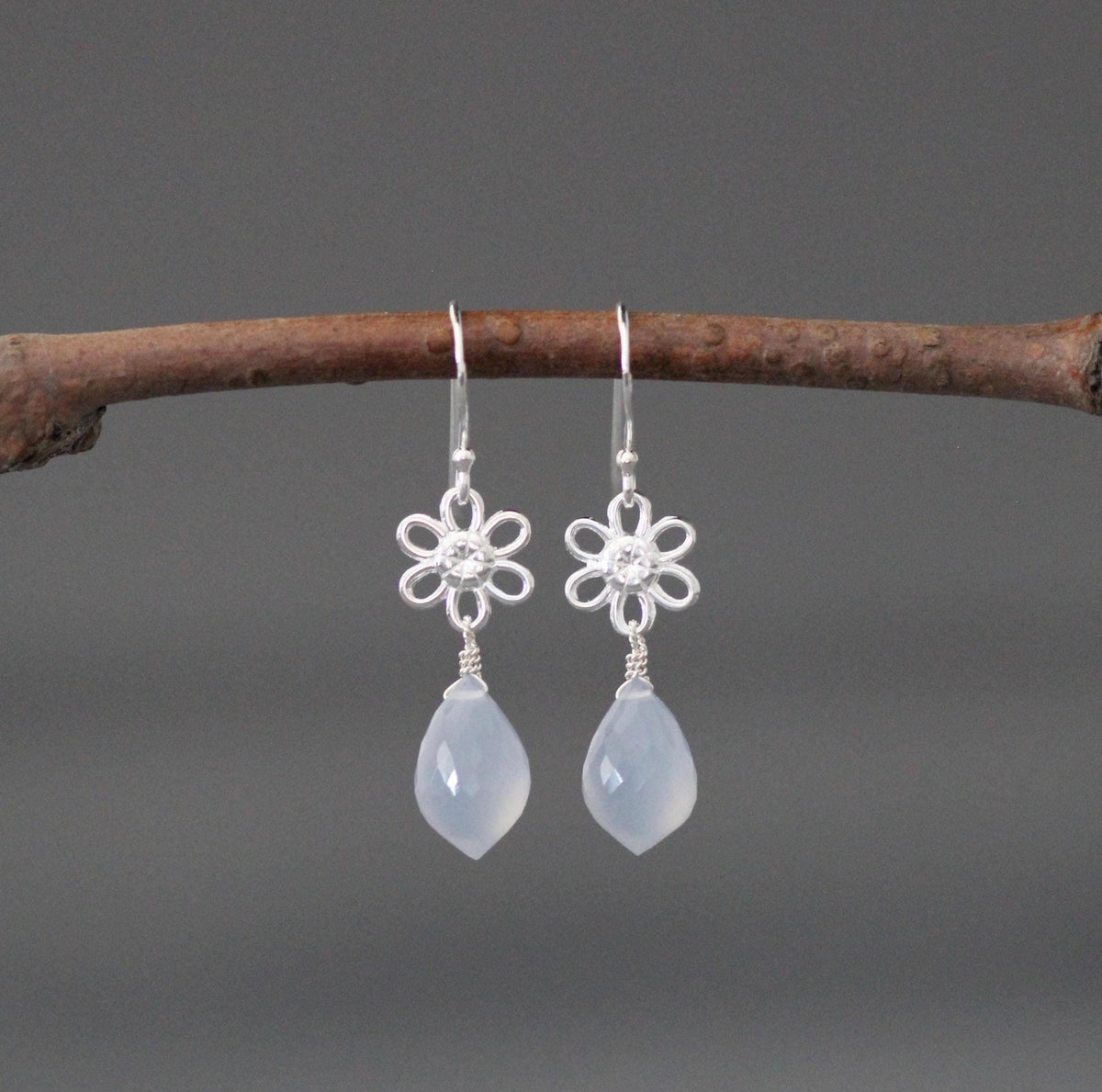 Sterling silver flower earrings with blue teardrop drops