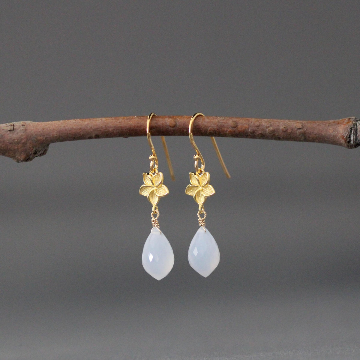Gold vermeil flower drop earrings with blue teardrop chalcedony stones