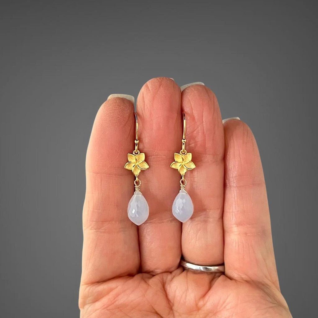 Gold vermeil flower and blue teardrop chalcedony drop earrings held on hand