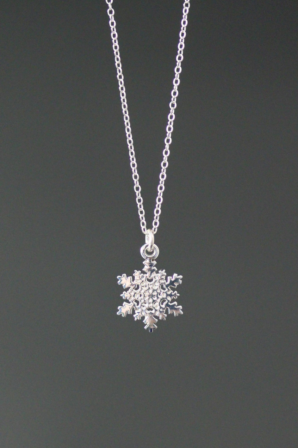 Sterling silver snowflake charm necklace with pendant on cable chain