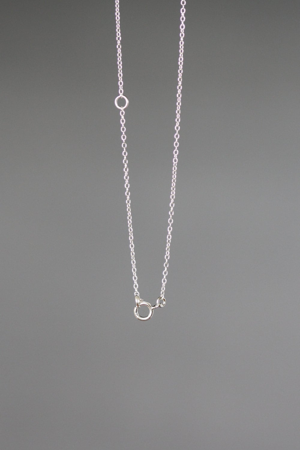 Sterling silver chain necklace with snowflake pendant and loop clasp