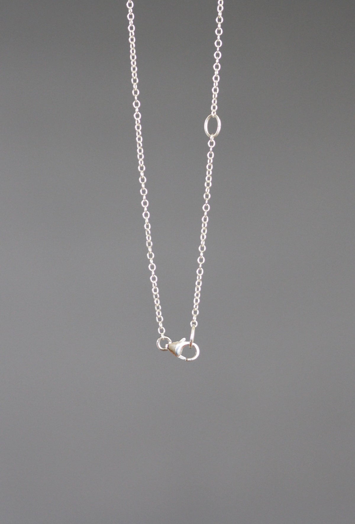 Sterling silver chain necklace with snowflake pendant and round clasp