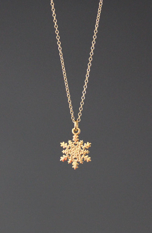 Gold vermeil snowflake charm necklace on a fine chain