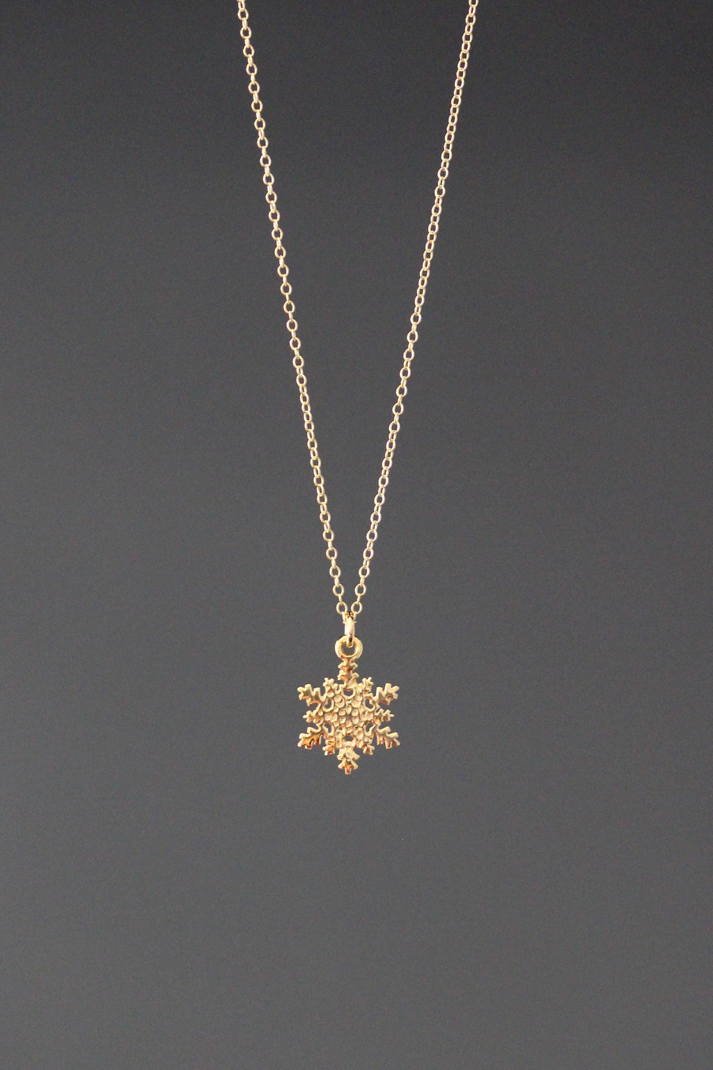 Gold vermeil snowflake charm necklace with a delicate chain