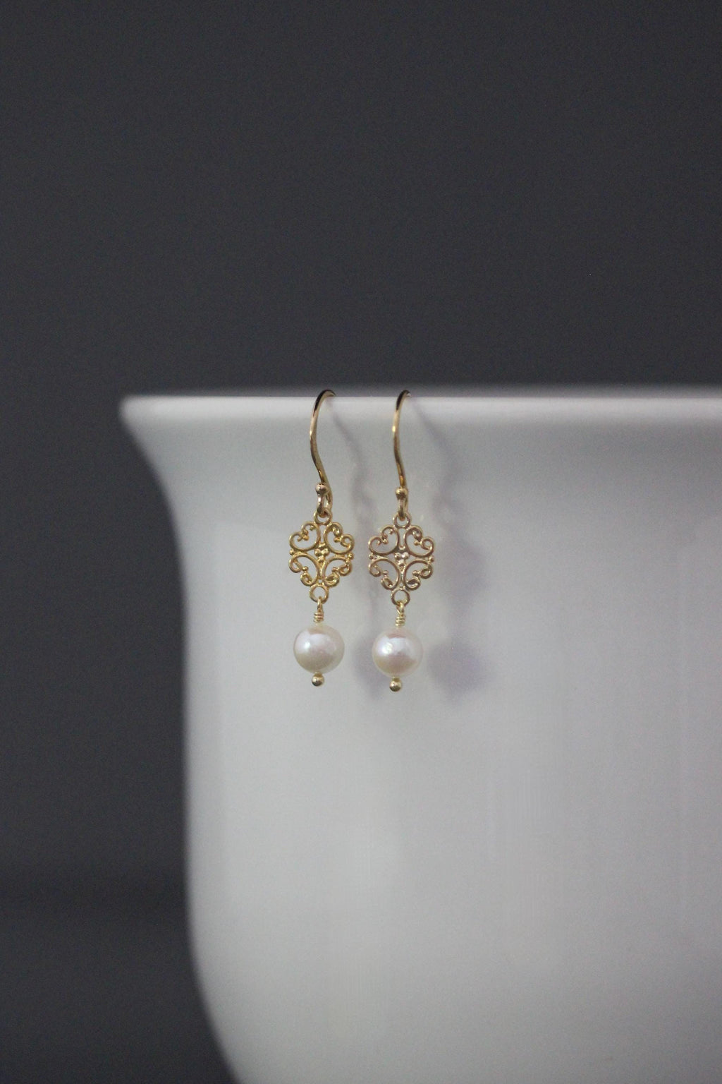 Gold vermeil pearl earrings with delicate scrollwork links and fishhook wires