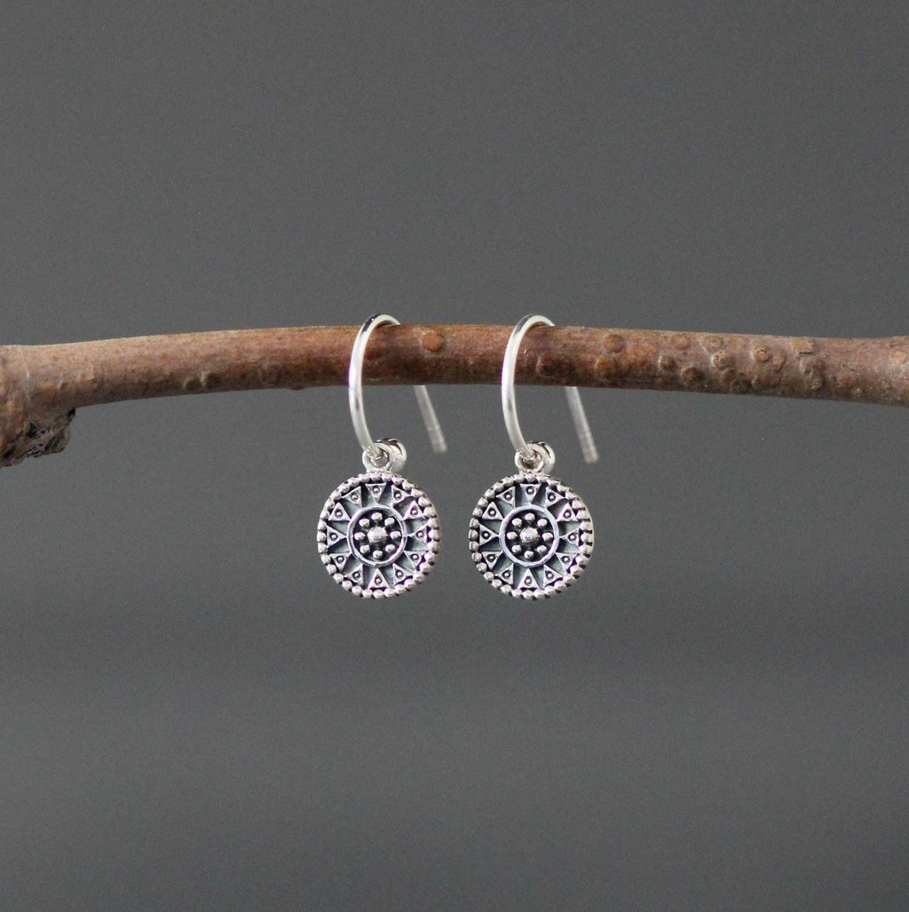 Sterling silver medallion charm earrings with fishhook wires and detailed circular designs