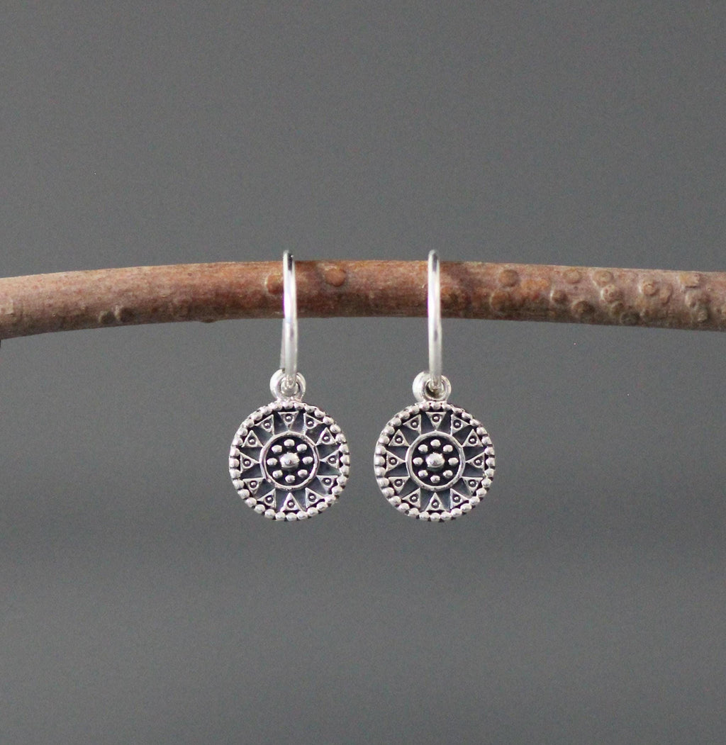 Sterling silver earrings with large round medallion charms and long fishhook wires