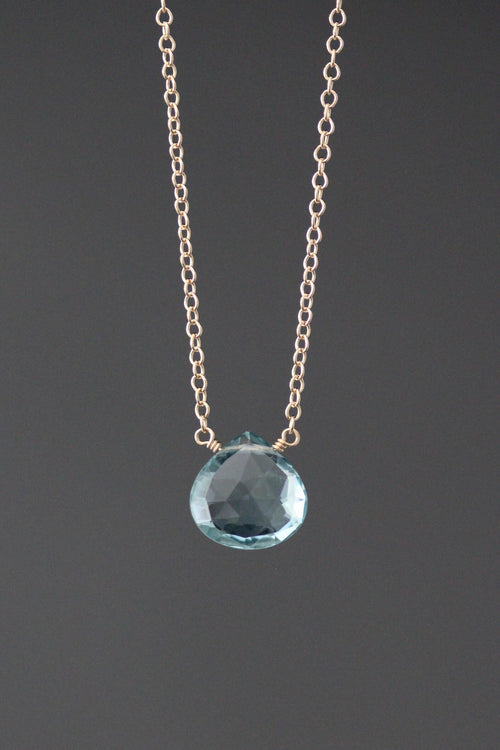 Teardrop crystal pendant necklace with faceted blue stone on metal chain