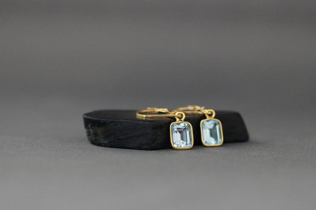 Gold vermeil leverback earrings with square light blue bezel-set emerald-cut stones