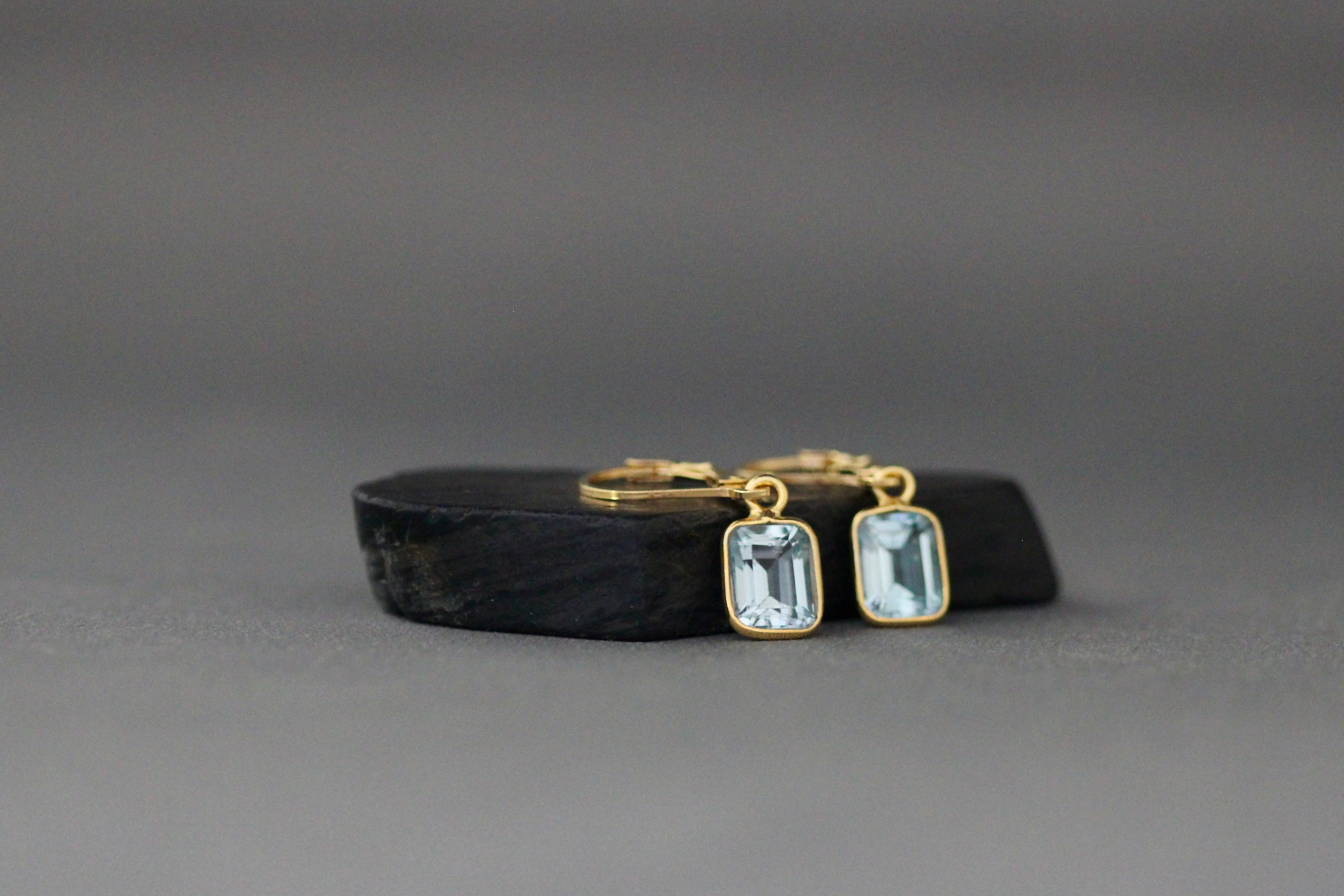 Gold vermeil leverback earrings with square light blue bezel-set emerald-cut stones