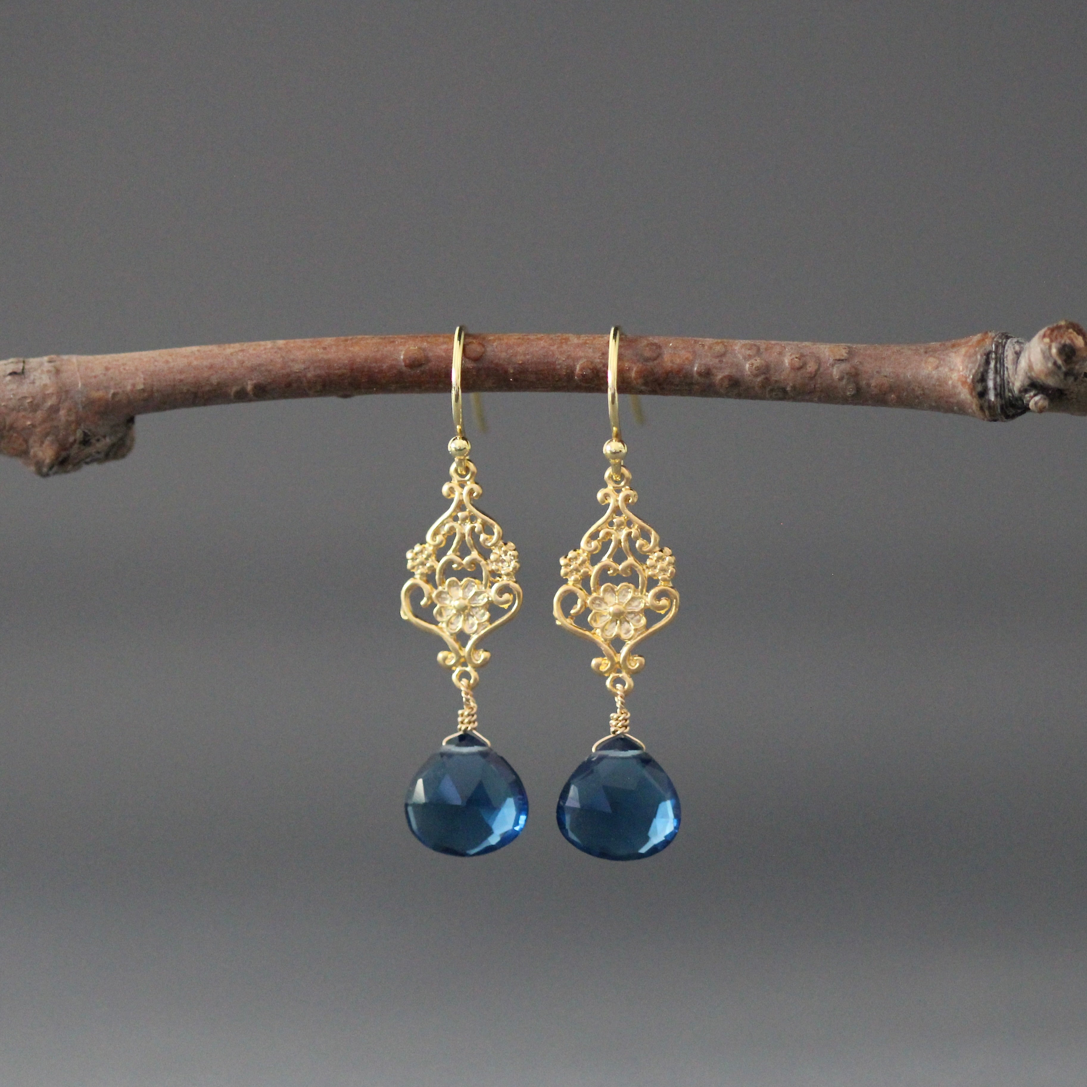 Gold vermeil filigree drop earrings with blue topaz faceted stones