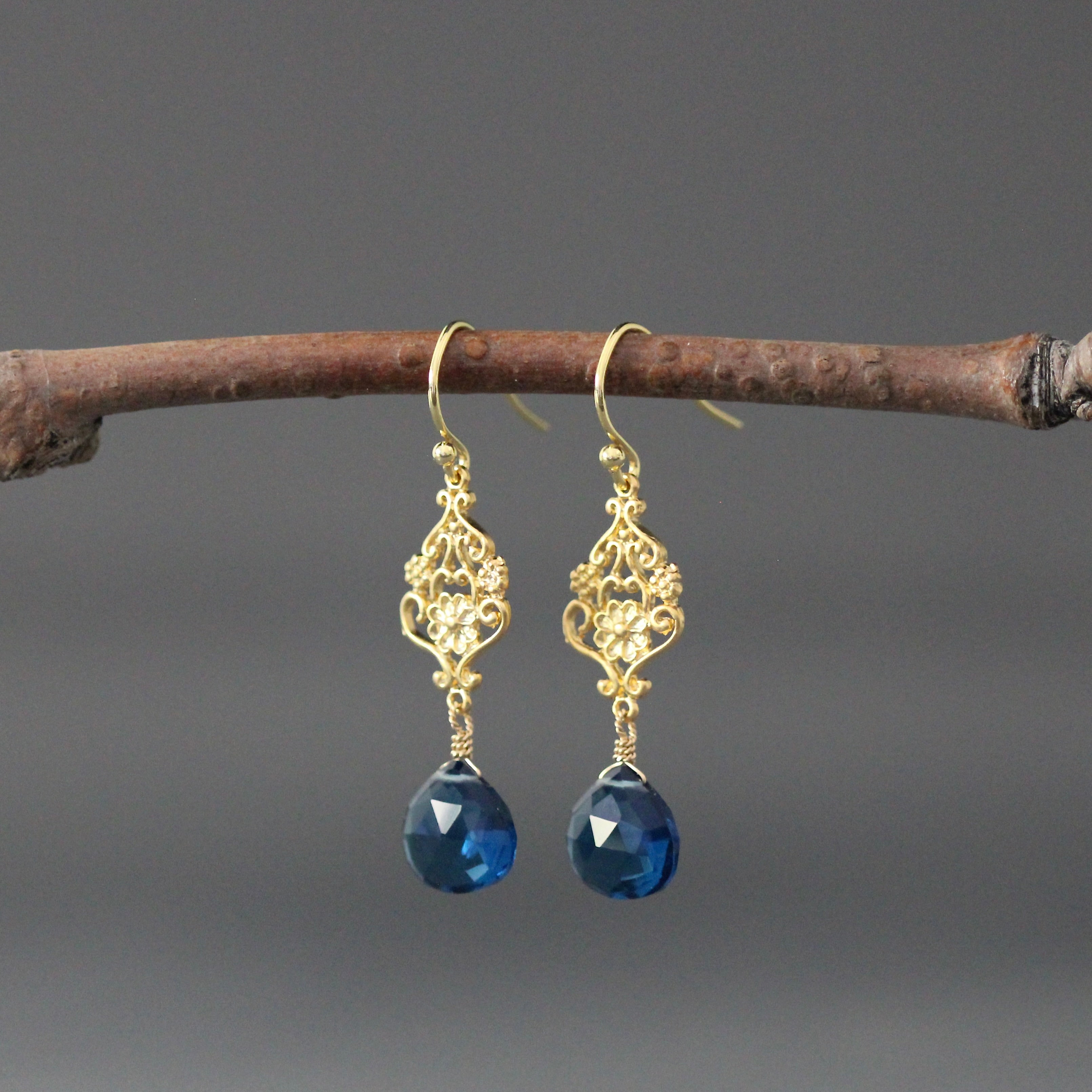 Gold vermeil filigree drop earrings with dark blue topaz teardrop stones