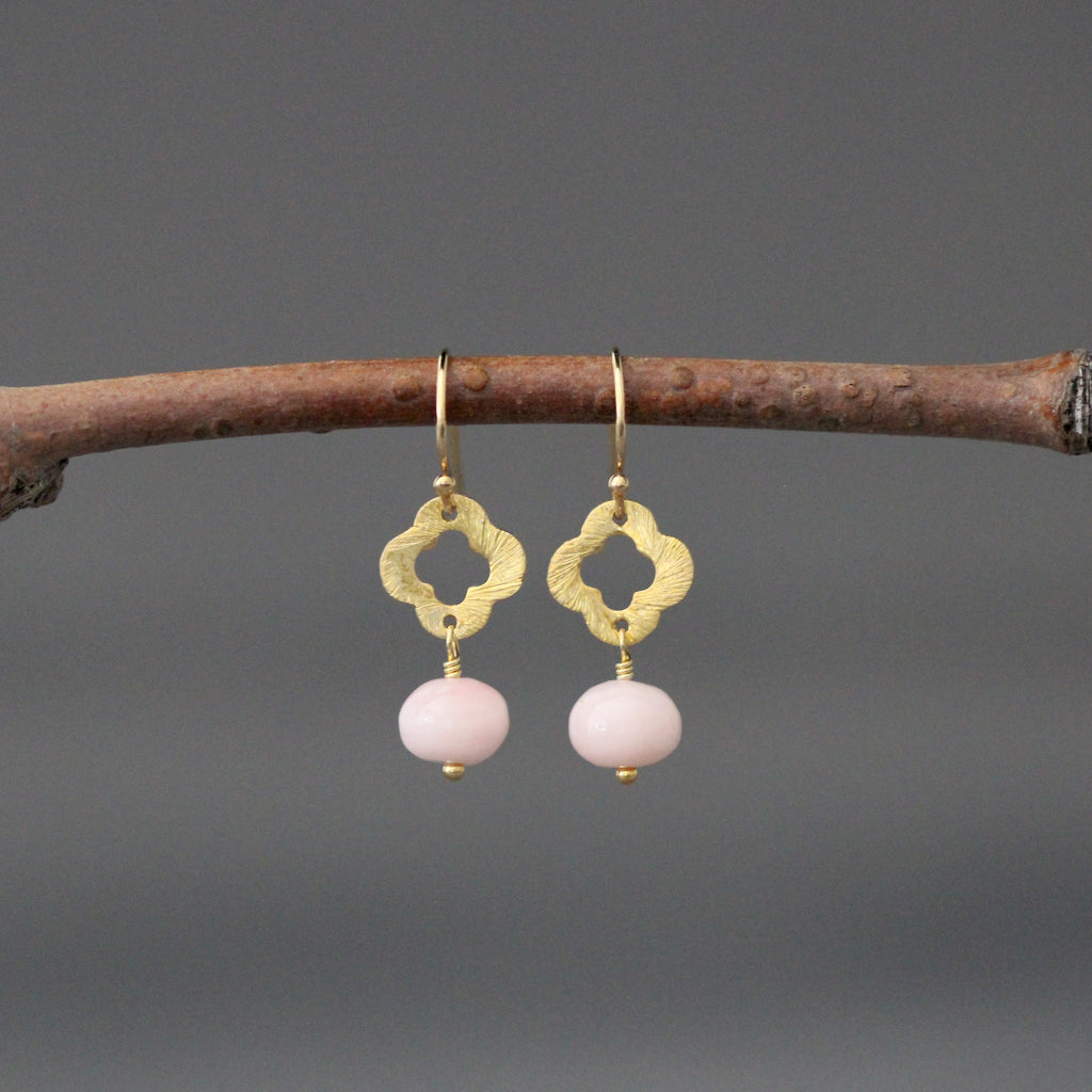 Gold drop earrings with clover charm and pink opal bead dangles on hooks
