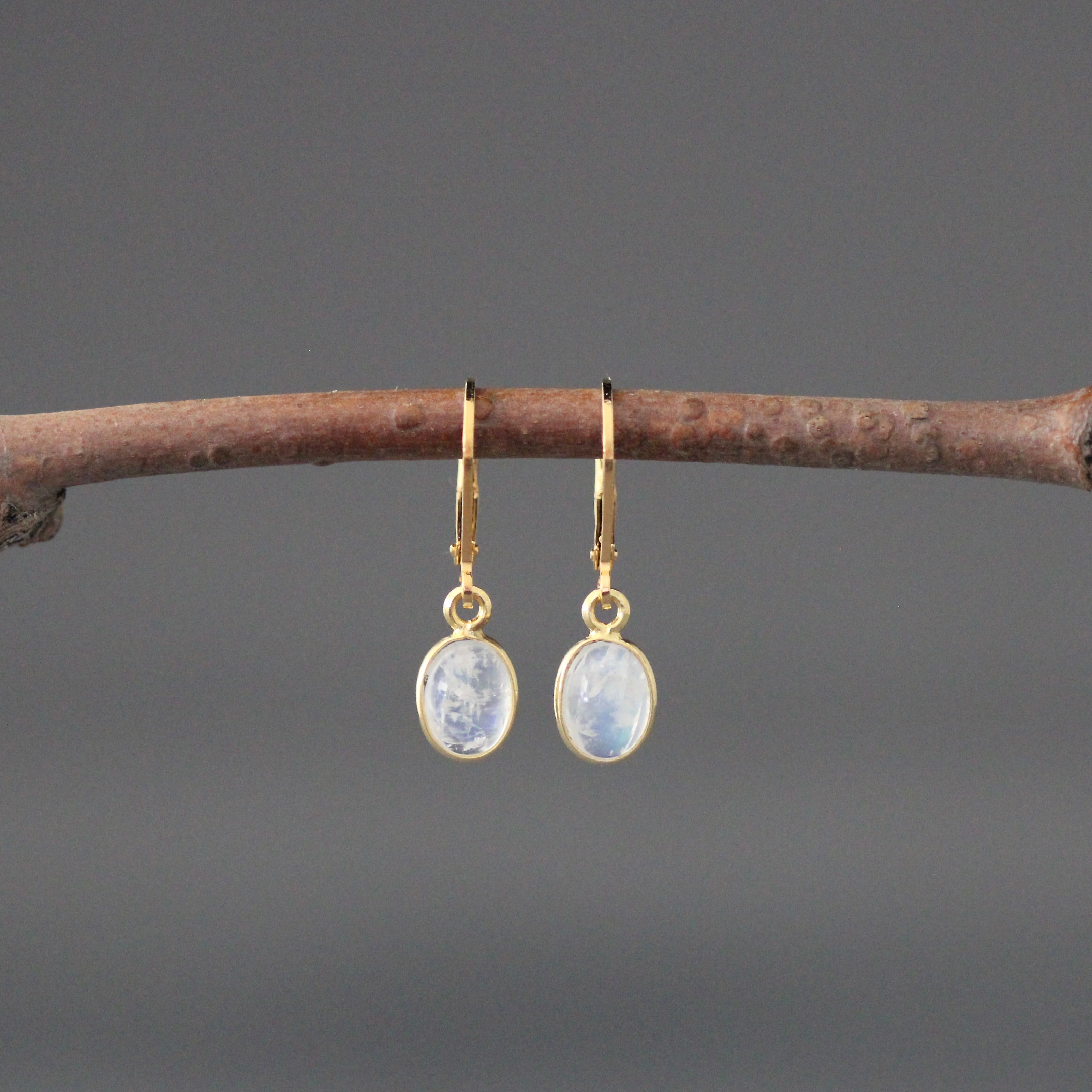 Gold vermeil leverback earrings with oval blue moonstone cabochons in bezel settings