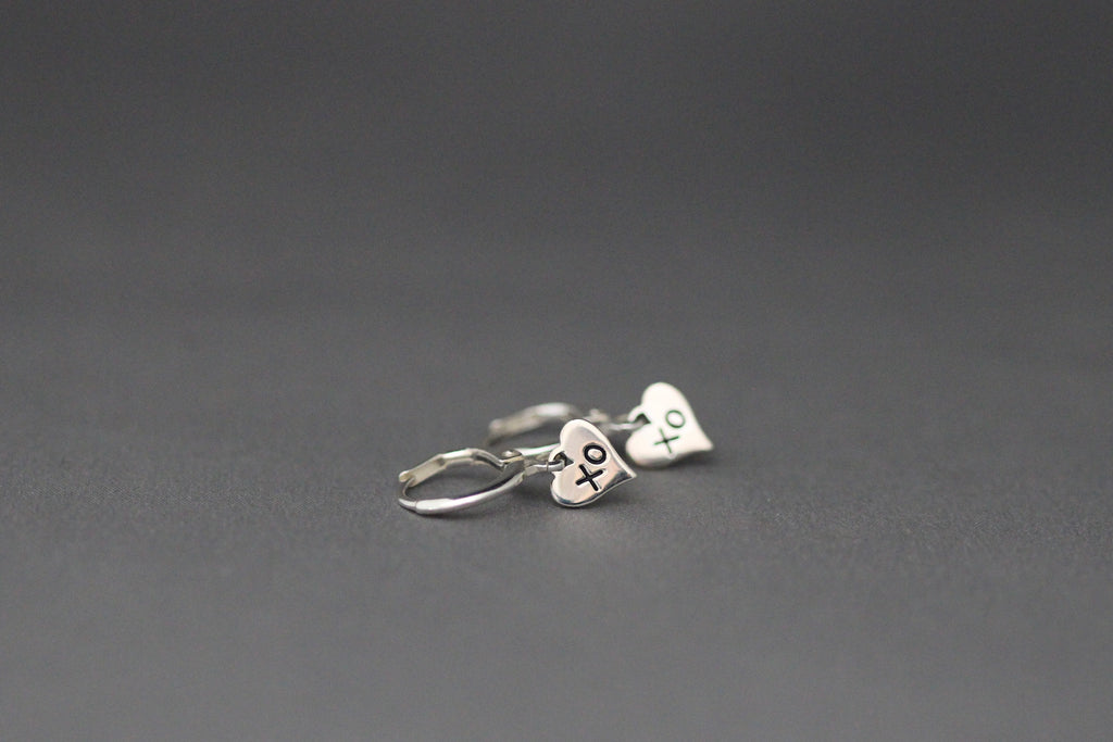 Silver leverback earrings with XO heart charms on small huggie hoops