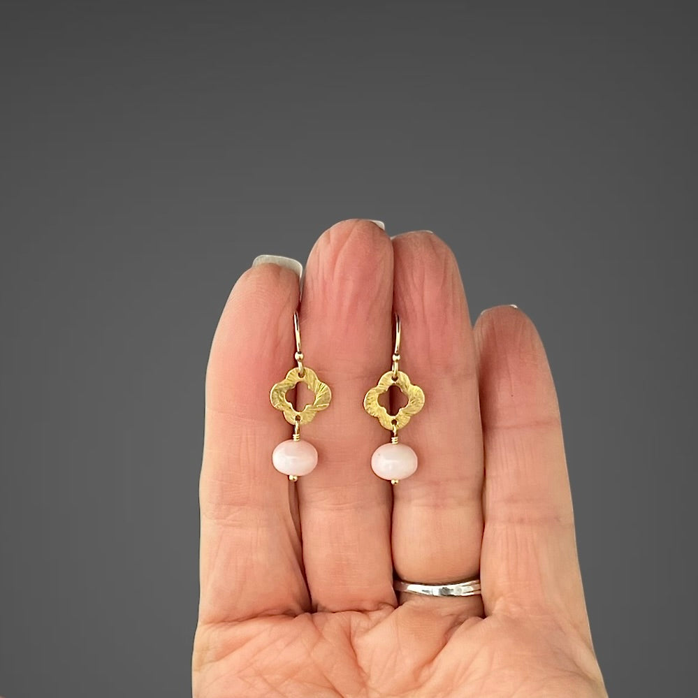 Gold hoop earrings with pink opal beads and four-petal station charm dangles