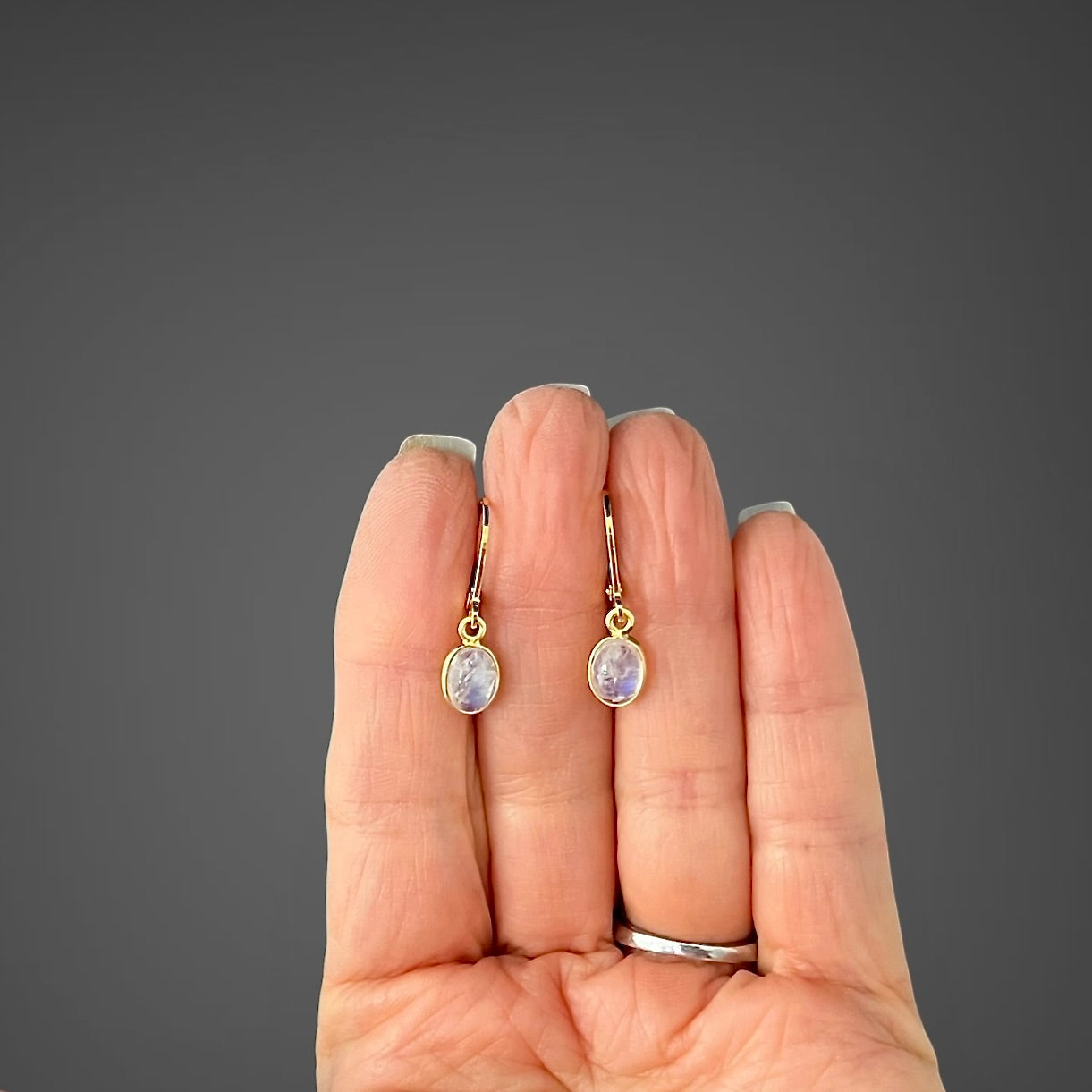 Gold vermeil leverback earrings with small oval moonstone cabochon bezels
