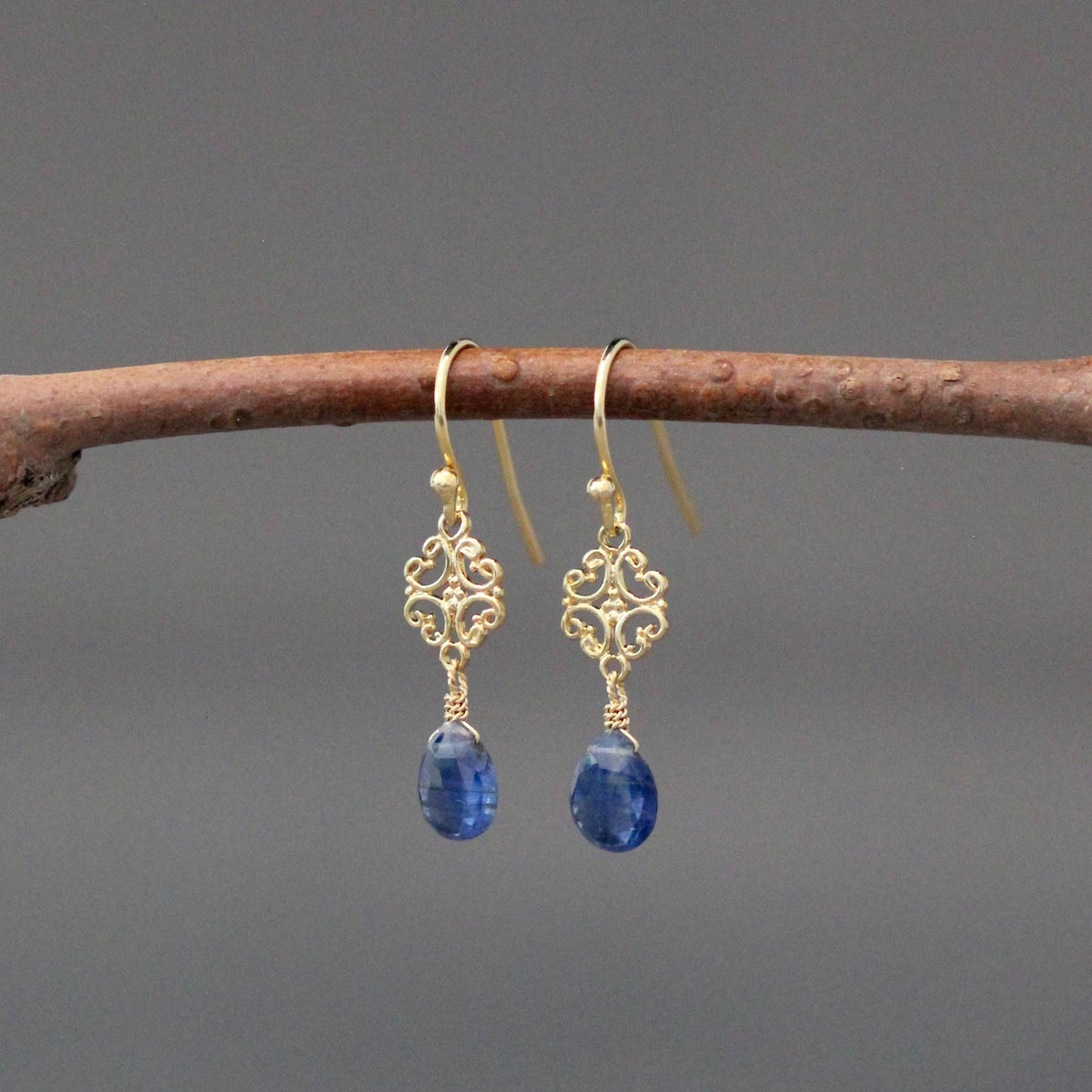Gold vermeil drop earrings with ornate filigree and blue kyanite teardrop stones