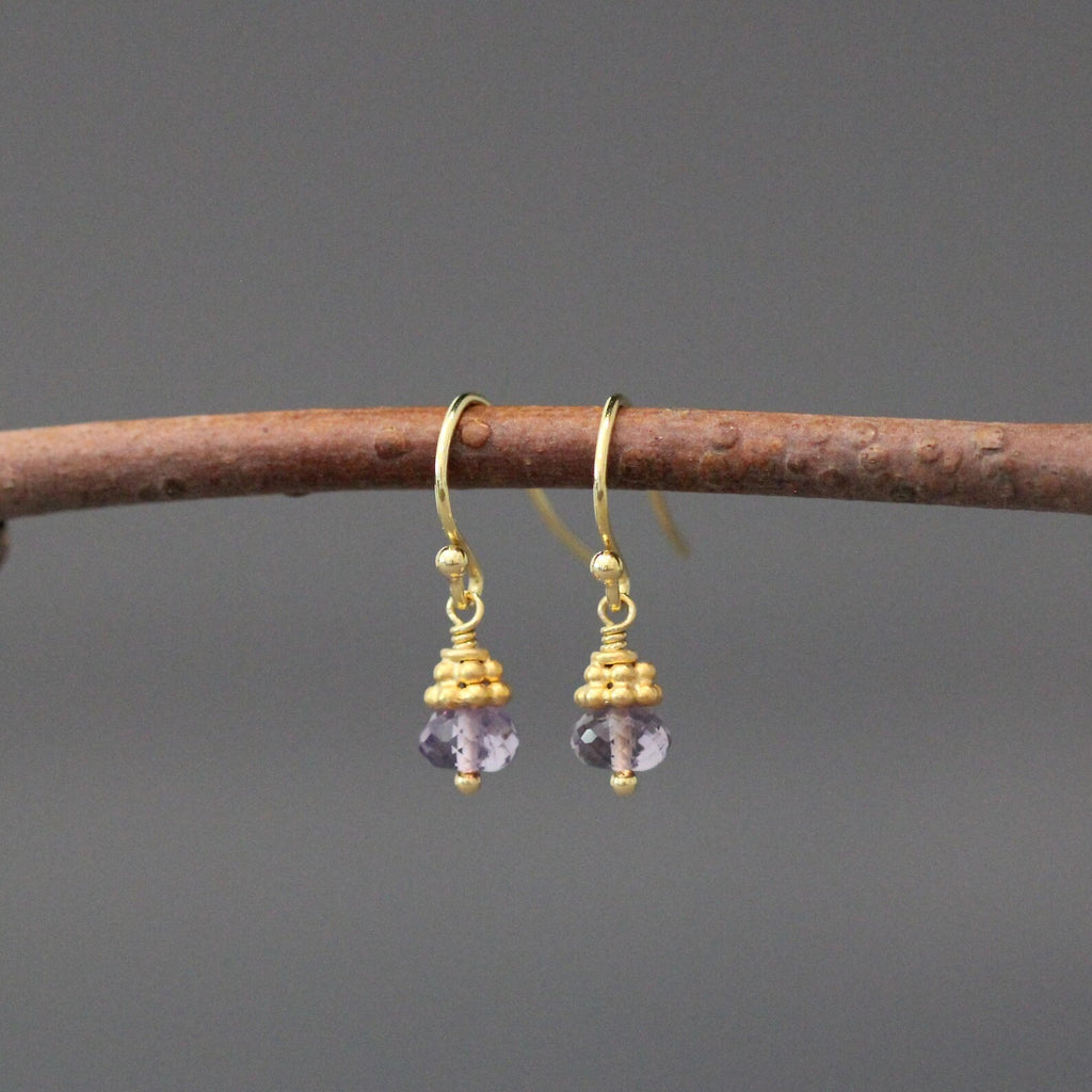 Purple amethyst button drop earrings with gold-tone hoops and dangling bead caps