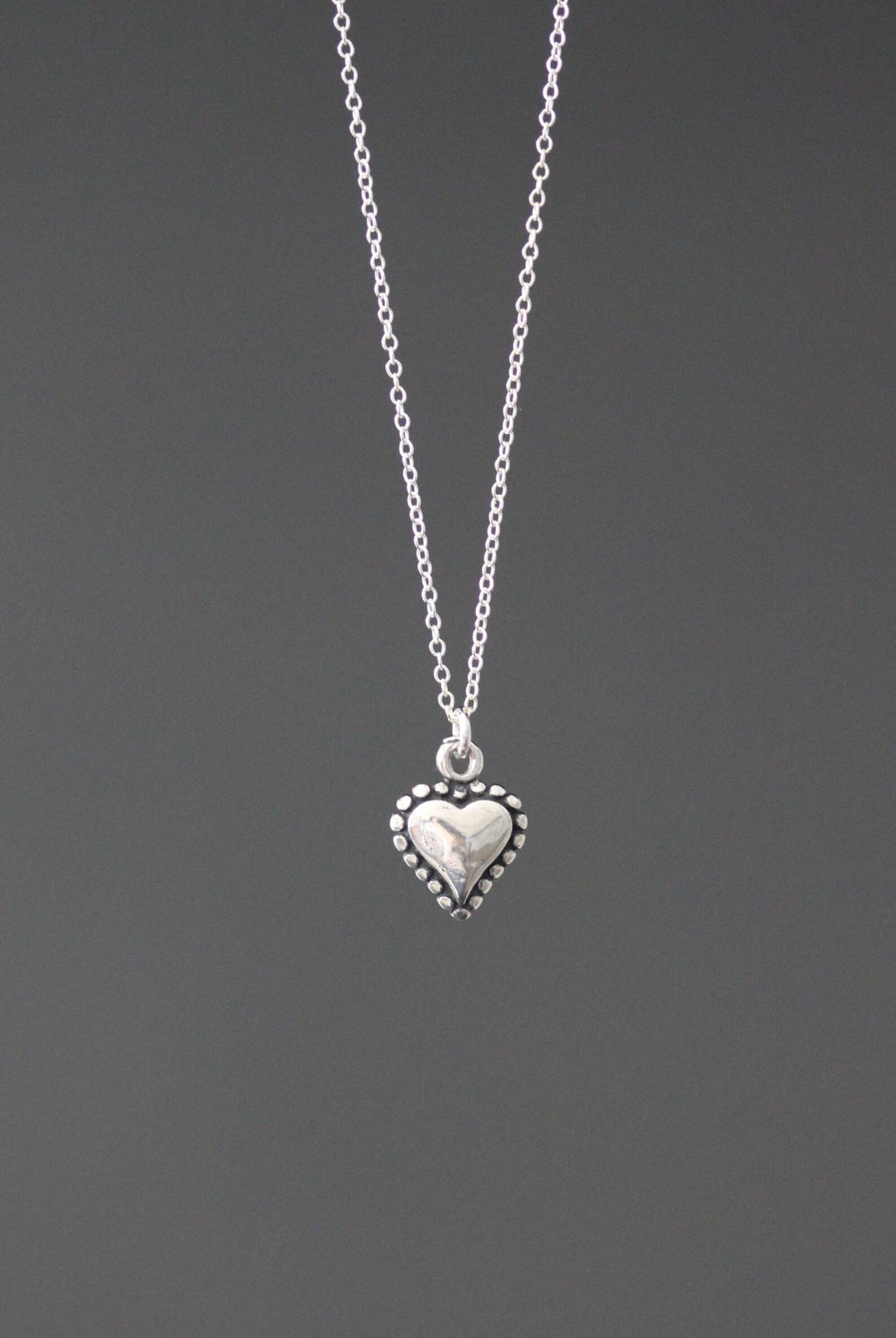 Silver heart charm necklace on sterling silver chain