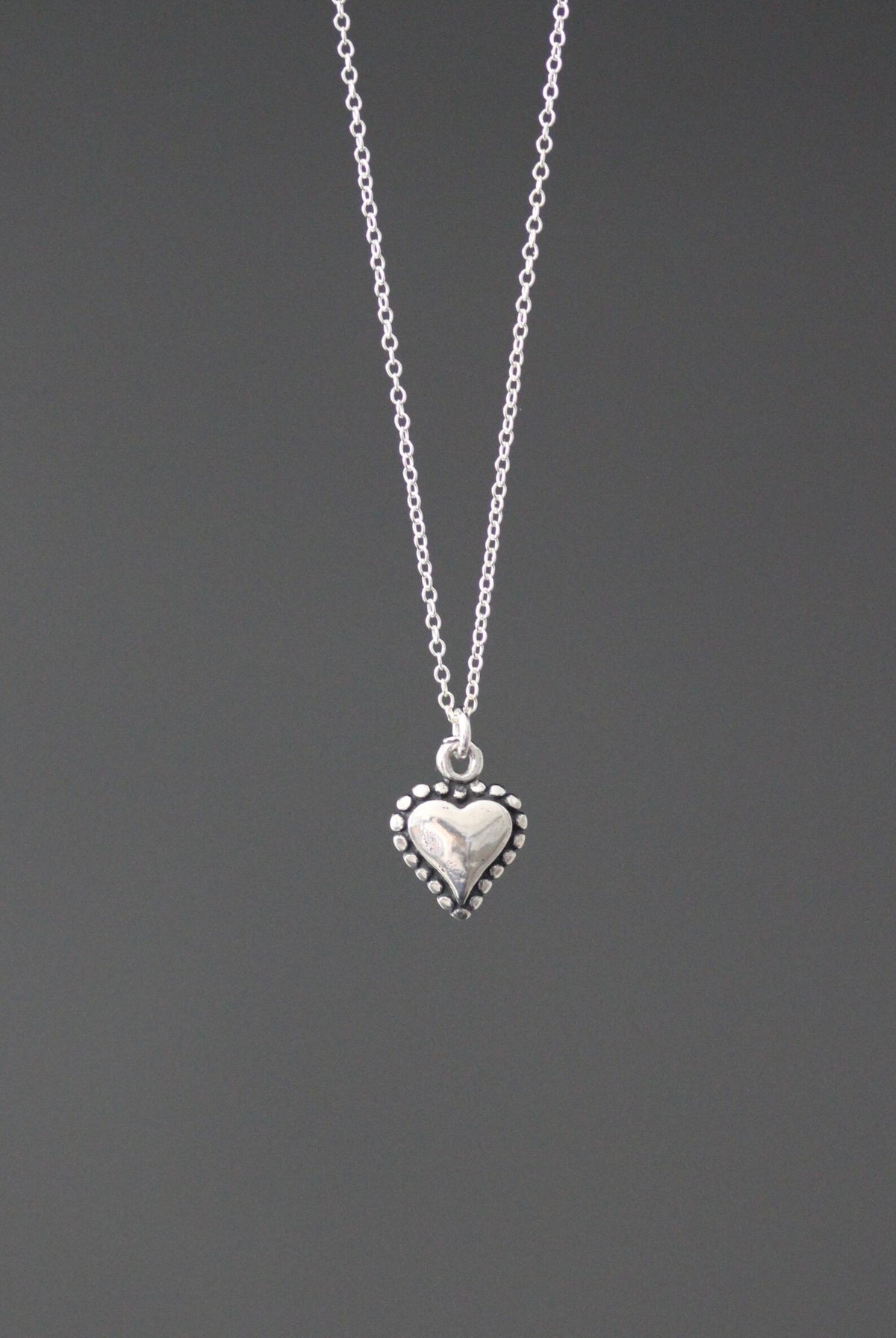 Silver heart charm necklace on sterling silver chain