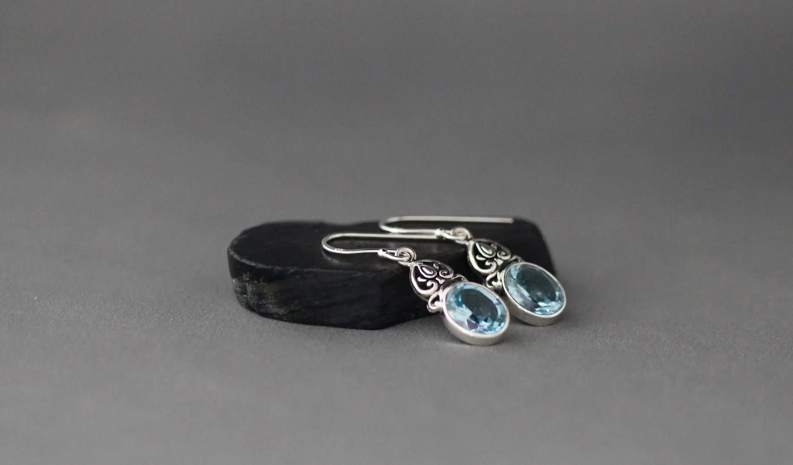 Oval-Cut Blue Topaz and Bali Silver Earrings