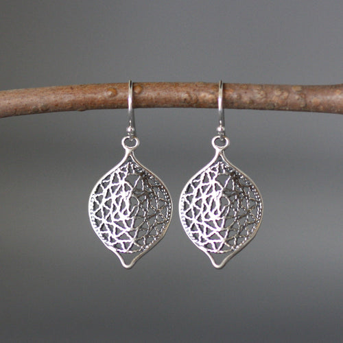 Silver filigree dangle earrings with leaf-shaped wavy drop