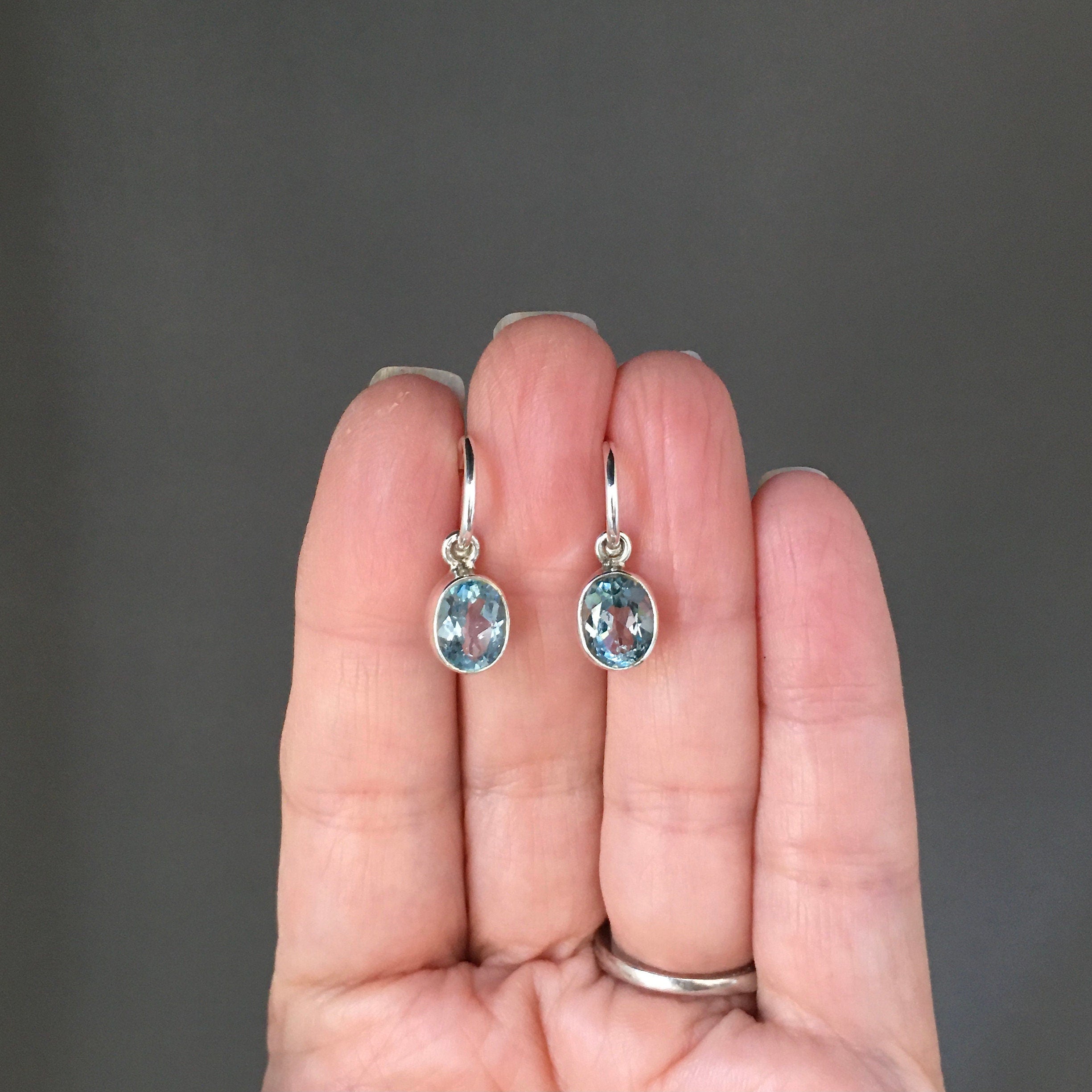 Blue Topaz Bezel Earrings Dangling from Sterling Silver Post Hoops
