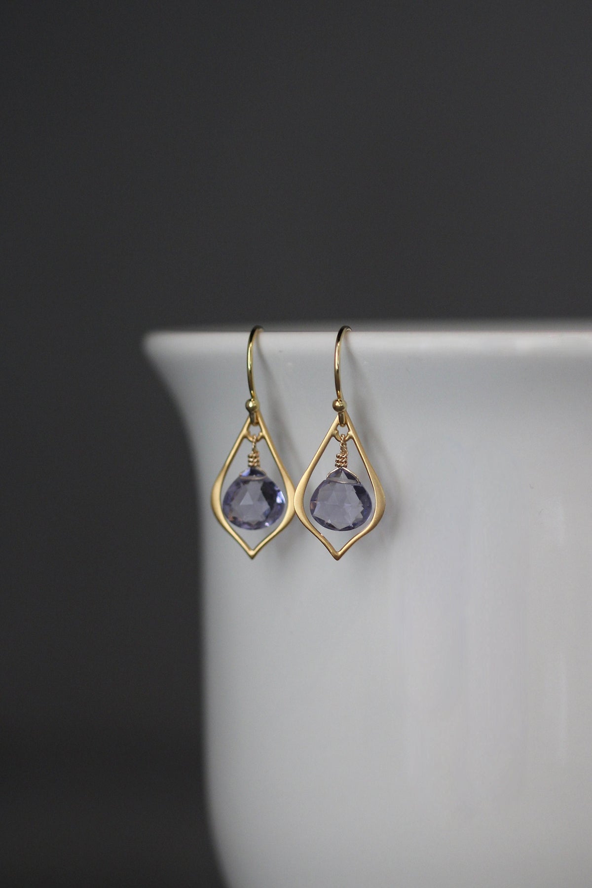 Matte gold vermeil chandelier earrings with dark purple teardrop gemstones