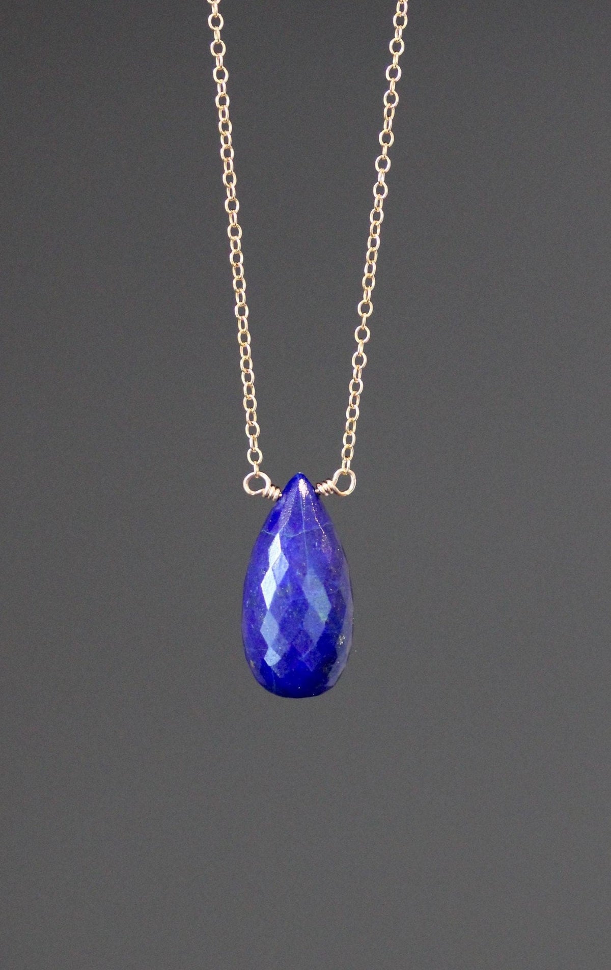 Blue faceted teardrop lapis pendant on gold filled chain necklace