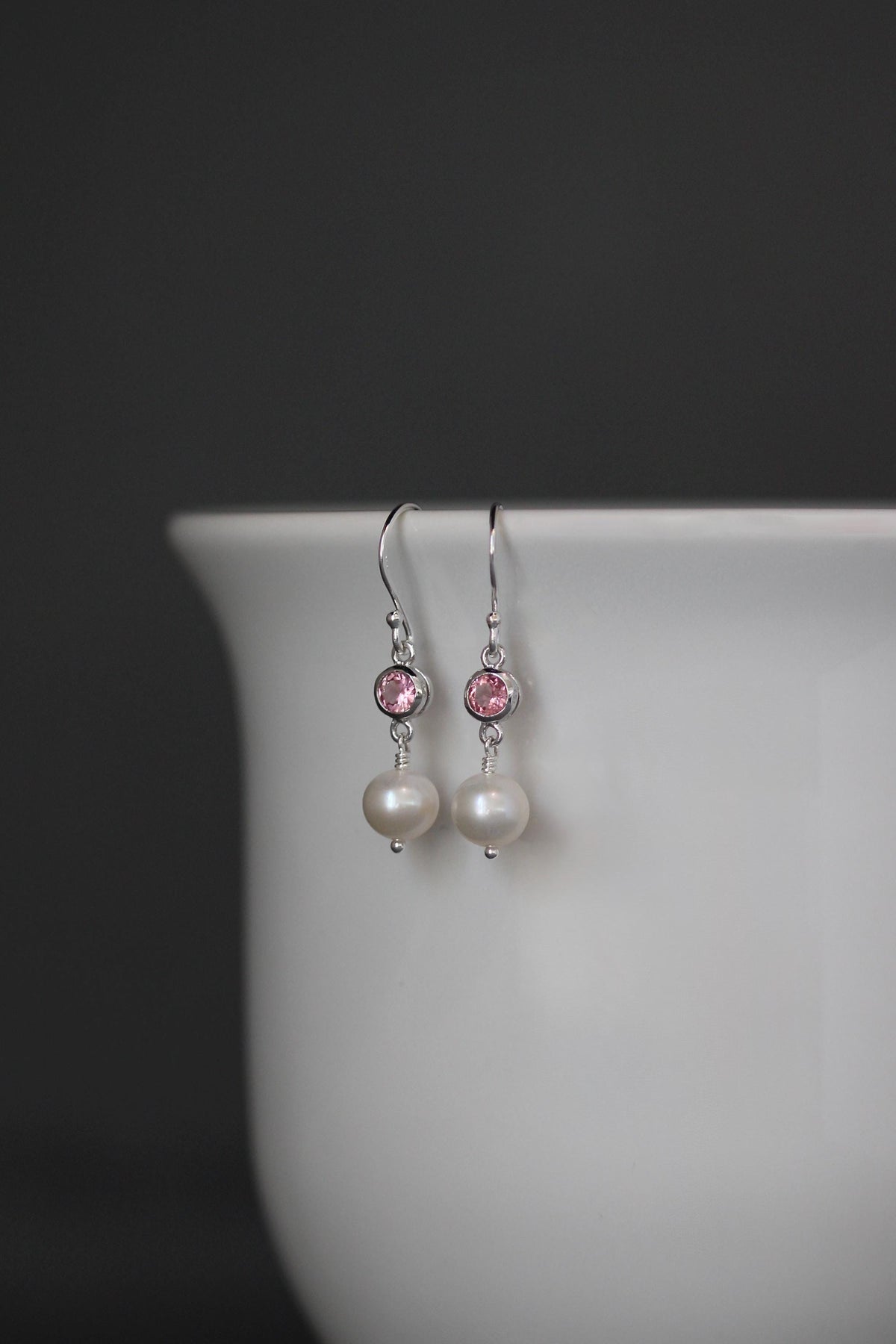Sterling silver dangle earrings with pink gemstone and white pearl drops